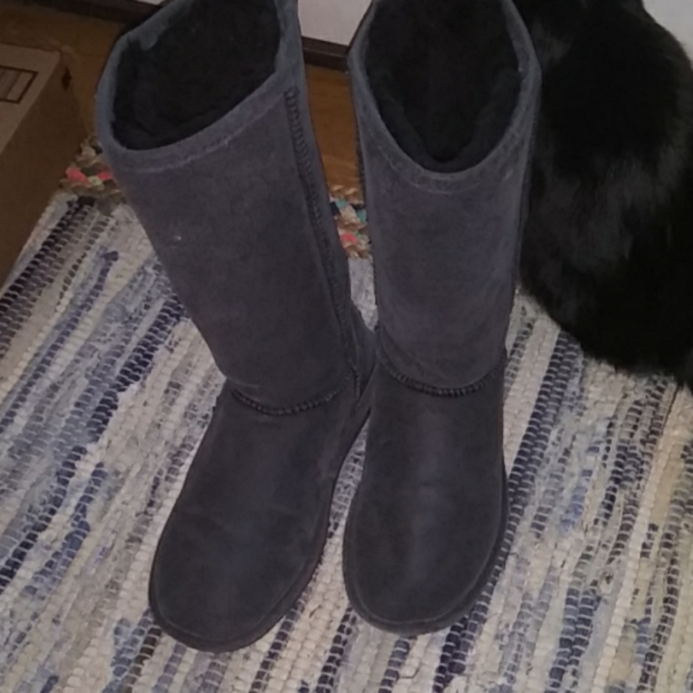 Black distressed leather bearpaw boots